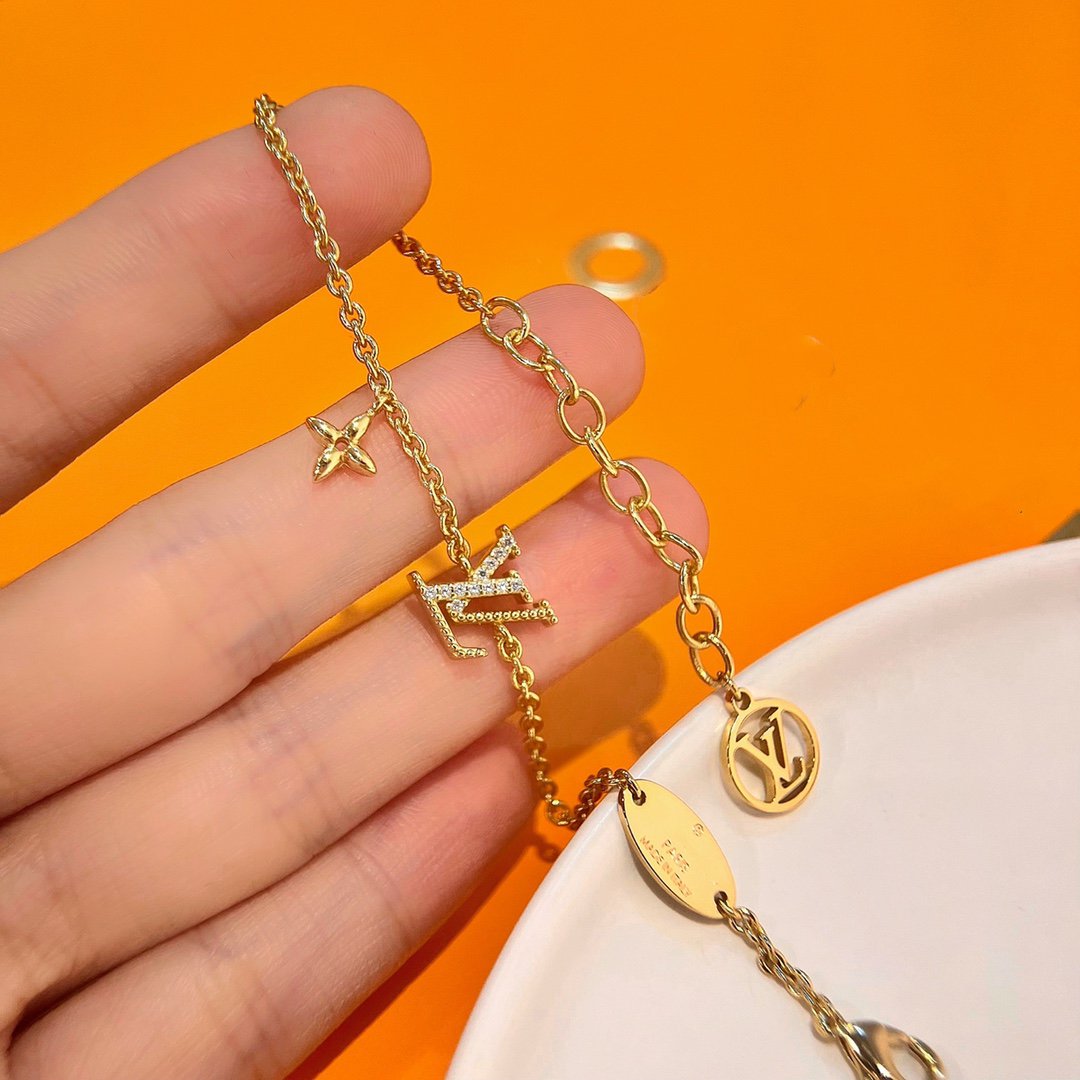 LOUIS VUITTON LOGO STAR MOTIF GOLD BRACELET