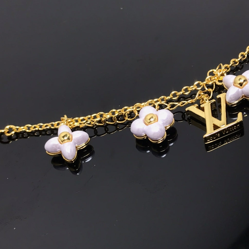 LOUIS VUITTON LOGO 6 MOTIF STAR AND SUN GOLD BRACELET