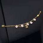 LOUIS VUITTON LOGO 6 MOTIF STAR AND SUN GOLD BRACELET