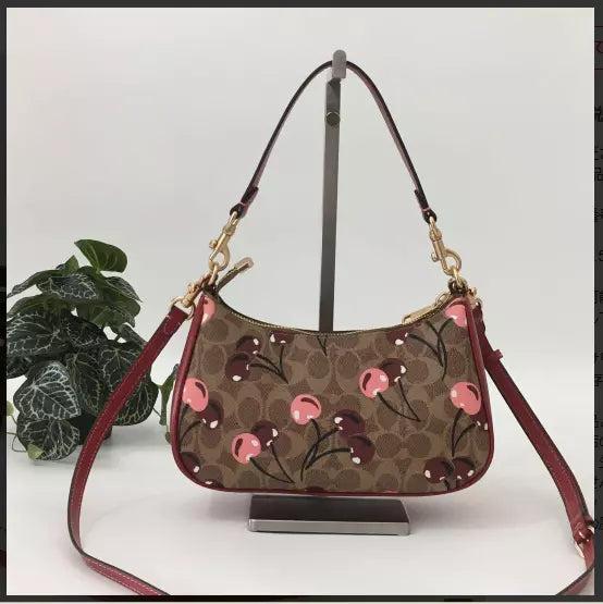 teri-shoulder-bag-signature-canvas-cherry-print Shoulder