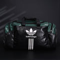balenciaga-x-adidas-large-duffel-travel-bag-black-green-with-trefoil-logo-and-triple-stripes Handle