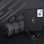 coach-signature-duffel-bag-black-monogram-canvas-with-leather-trim Handle