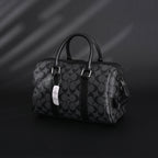 coach-signature-duffel-bag-black-monogram-canvas-with-leather-trim Handle