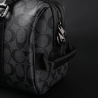 coach-signature-duffel-bag-black-monogram-canvas-with-leather-trim Handle