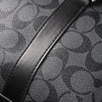 coach-signature-duffel-bag-black-monogram-canvas-with-leather-trim Handle